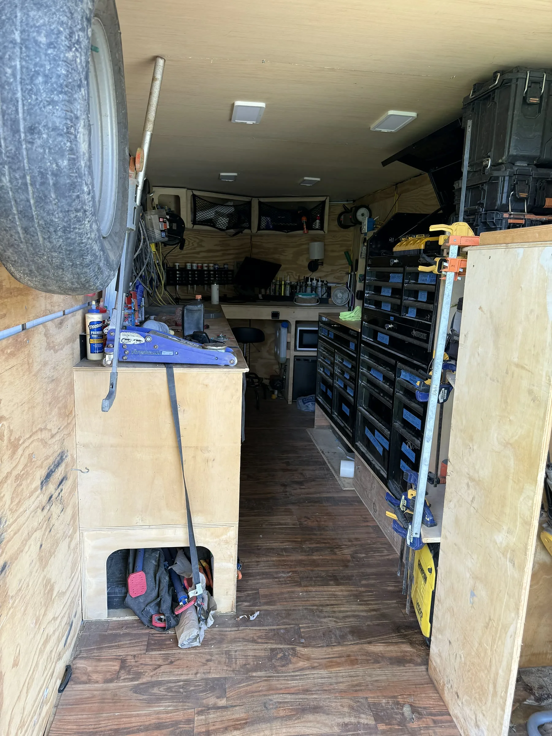 Central aisle of the working Biltout prototype with storage on both sides